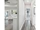 Open-concept home featuring hard surface floors, a living area, and a view of the ensuite bathroom at 4307 Dristol Ave, Spring Hill, FL 34609