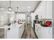 Modern kitchen with white cabinetry, granite countertops, and stainless-steel appliances at 4307 Dristol Ave, Spring Hill, FL 34609