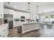Modern kitchen features white cabinets, stainless appliances, and spacious center island at 4307 Dristol Ave, Spring Hill, FL 34609
