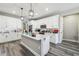 Bright, airy kitchen features white cabinets and a center island with bar seating at 4307 Dristol Ave, Spring Hill, FL 34609