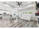 Inviting living space with comfortable seating and abundant natural light from large window at 4307 Dristol Ave, Spring Hill, FL 34609