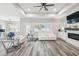 Bright living room featuring modern floors, recessed lighting, and a cozy seating area at 4307 Dristol Ave, Spring Hill, FL 34609