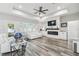 Bright living room featuring modern floors, recessed lighting, and a cozy seating area at 4307 Dristol Ave, Spring Hill, FL 34609