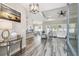 Open-concept living space featuring modern floors, a kitchen bar, and abundant natural light at 4307 Dristol Ave, Spring Hill, FL 34609