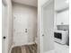 Mud room boasts white cabinets, modern doors, and a storage bench, offering a functional entry space at 4307 Dristol Ave, Spring Hill, FL 34609