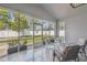 Screened patio with seating, views of the backyard, and access to the outdoors at 4307 Dristol Ave, Spring Hill, FL 34609