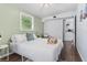 Relaxing main bedroom with a soft bed, peaceful accents, and easy access to the connected kitchen area at 4803 N 9Th St, Tampa, FL 33603
