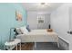 Comfortable main bedroom featuring a cozy bed, stylish side tables, and bright natural light at 4803 N 9Th St, Tampa, FL 33603