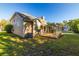 Backyard showing exterior of home with a screened in porch at 5167 Sterling Manor Dr, Tampa, FL 33647