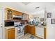 Cozy kitchen with bright countertops, white appliances and tile flooring at 5167 Sterling Manor Dr, Tampa, FL 33647