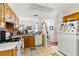 Cozy kitchen with bright countertops, white appliances and tile flooring at 5167 Sterling Manor Dr, Tampa, FL 33647