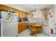 Compact kitchen featuring eat-in breakfast nook and white appliances at 5167 Sterling Manor Dr, Tampa, FL 33647