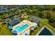 Aerial view of the community pool, playground, and green common space at 5758 Hollingworth Trl, Wesley Chapel, FL 33545