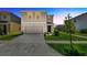 Two-story home with a two-car garage, landscaping, and a concrete driveway at 5758 Hollingworth Trl, Wesley Chapel, FL 33545