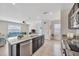 Bright kitchen with granite countertops, stainless steel appliances, and tile flooring at 5758 Hollingworth Trl, Wesley Chapel, FL 33545