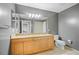 Bathroom featuring double sinks, granite countertops, and modern fixtures at 628 Cleveland St # 1208, Clearwater, FL 33755
