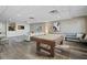 Relaxing game room featuring a pool table, comfortable seating, and modern decor at 628 Cleveland St # 1208, Clearwater, FL 33755