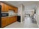 Functional kitchenette featuring ample cabinetry and modern appliances conveniently located next to a common room at 628 Cleveland St # 1208, Clearwater, FL 33755