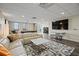 Spacious common room with a comfortable couch and a flat screen tv at 628 Cleveland St # 1208, Clearwater, FL 33755