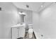 Bathroom featuring a white vanity, toilet, and a shower with white subway tile at 7205 Mayfield Dr, Port Richey, FL 34668