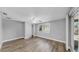 Bedroom with wood floor, closet and sliding glass doors to the patio at 7205 Mayfield Dr, Port Richey, FL 34668