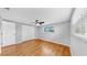 Bedroom with wood floor, closet and ceiling fan at 7205 Mayfield Dr, Port Richey, FL 34668