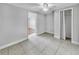 Bedroom featuring tiled floor, closet and neutral colored walls at 7205 Mayfield Dr, Port Richey, FL 34668