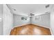 Bedroom with wood floor, closet and ceiling fan at 7205 Mayfield Dr, Port Richey, FL 34668