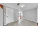 Hallway featuring tiled floor, base molding and neutral colored walls at 7205 Mayfield Dr, Port Richey, FL 34668