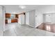 Open kitchen with granite countertops, tile flooring, and stainless steel appliances at 7205 Mayfield Dr, Port Richey, FL 34668