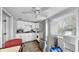 Modern kitchen with stainless steel appliances, white cabinets, and a window at 7205 Mayfield Dr, Port Richey, FL 34668