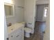 Updated bathroom with a new faucet and vanity with hardwood flooring in view at 807 Nectar Rd, Venice, FL 34293