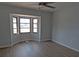 Bedroom featuring a bay window allowing for natural light and hardwood flooring at 807 Nectar Rd, Venice, FL 34293