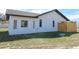 White exterior showing multiple window styles and a modern fence at 807 Nectar Rd, Venice, FL 34293