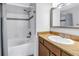 Bathroom features a white sink with granite countertop, and a combined shower and tub at 115 112Th Ne Ave # 310, St Petersburg, FL 33716