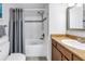 Bathroom featuring a shower and tub combination, vanity, and grey color scheme at 115 112Th Ne Ave # 310, St Petersburg, FL 33716
