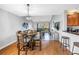 Open-concept living and dining area with a view of the screened-in balcony at 115 112Th Ne Ave # 310, St Petersburg, FL 33716