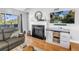 Comfortable living room featuring a fireplace, stylish decor, and hardwood floors at 115 112Th Ne Ave # 310, St Petersburg, FL 33716