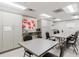Well-lit activity room with tables, chairs, and storage, ideal for crafts and community gatherings at 11521 Rose Tree Dr, New Port Richey, FL 34654