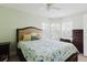 Cozy bedroom with large windows, plantation shutters, and neutral color palette at 11521 Rose Tree Dr, New Port Richey, FL 34654