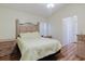 Bright bedroom features light wood furnishings and soft yellow color scheme at 11521 Rose Tree Dr, New Port Richey, FL 34654