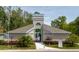 Charming community center features a welcoming entrance and lovely landscaping, perfect for gatherings and events at 11521 Rose Tree Dr, New Port Richey, FL 34654