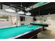 Community game room with two billiards tables ready for a friendly competition at 11521 Rose Tree Dr, New Port Richey, FL 34654