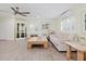 Bright living room with ceiling fan, shuttered windows, and comfortable furnishings at 11521 Rose Tree Dr, New Port Richey, FL 34654