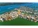 Wide aerial perspective of a waterfront community, emphasizing boating access and coastal lifestyle at 118 Wall St, Redington Shores, FL 33708