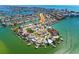 Stunning aerial view of waterfront homes and canals, highlighting the community's coastal charm at 118 Wall St, Redington Shores, FL 33708