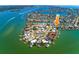 Panoramic aerial view of waterfront homes with multiple docks, highlighting coastal community and boating access at 118 Wall St, Redington Shores, FL 33708