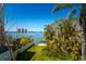 Waterfront property featuring a well-maintained backyard and picturesque views at 118 Wall St, Redington Shores, FL 33708