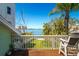 Enjoy stunning water views from the balcony of this home with lush greenery at 118 Wall St, Redington Shores, FL 33708
