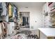 Well-organized walk-in closet with custom shelving, a door to another space, and a decorative rug at 118 Wall St, Redington Shores, FL 33708